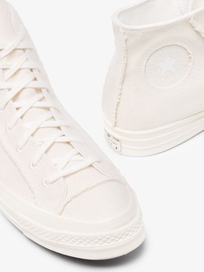 white canvas high tops